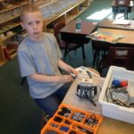 4-H member works on a robotics project